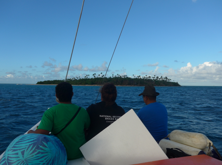 Approaching Fafá Island in the launch at sunset with three of our fellow travelers sitting on the top of the cabin.